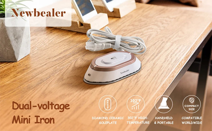 Dual voltage travel iron resting on a wooden surface, featuring a compact design and cord for portability.